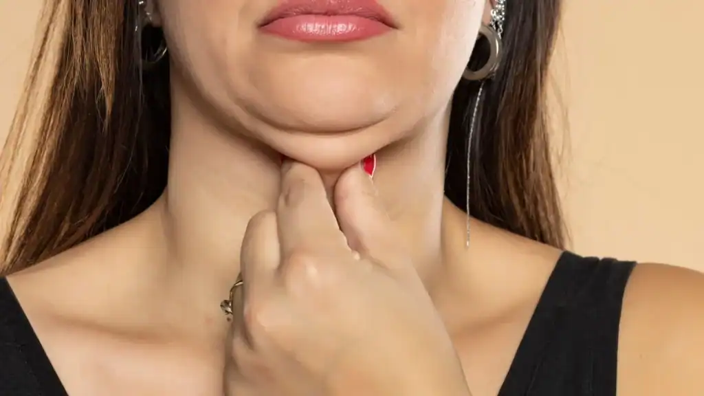 An image of a woman with double chin, sad, worried : Non Surgical Double Chin Removal Treatment in Ladymoor, UK