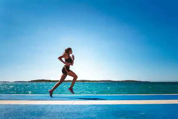 Woman running showing strong leg muscle Ladymoor